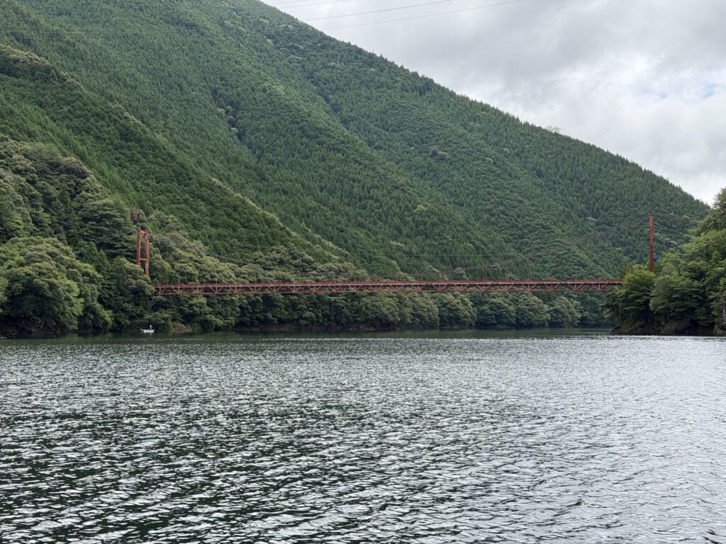 Steep mountain terrain surrounding Ikehara Dam reservoir
