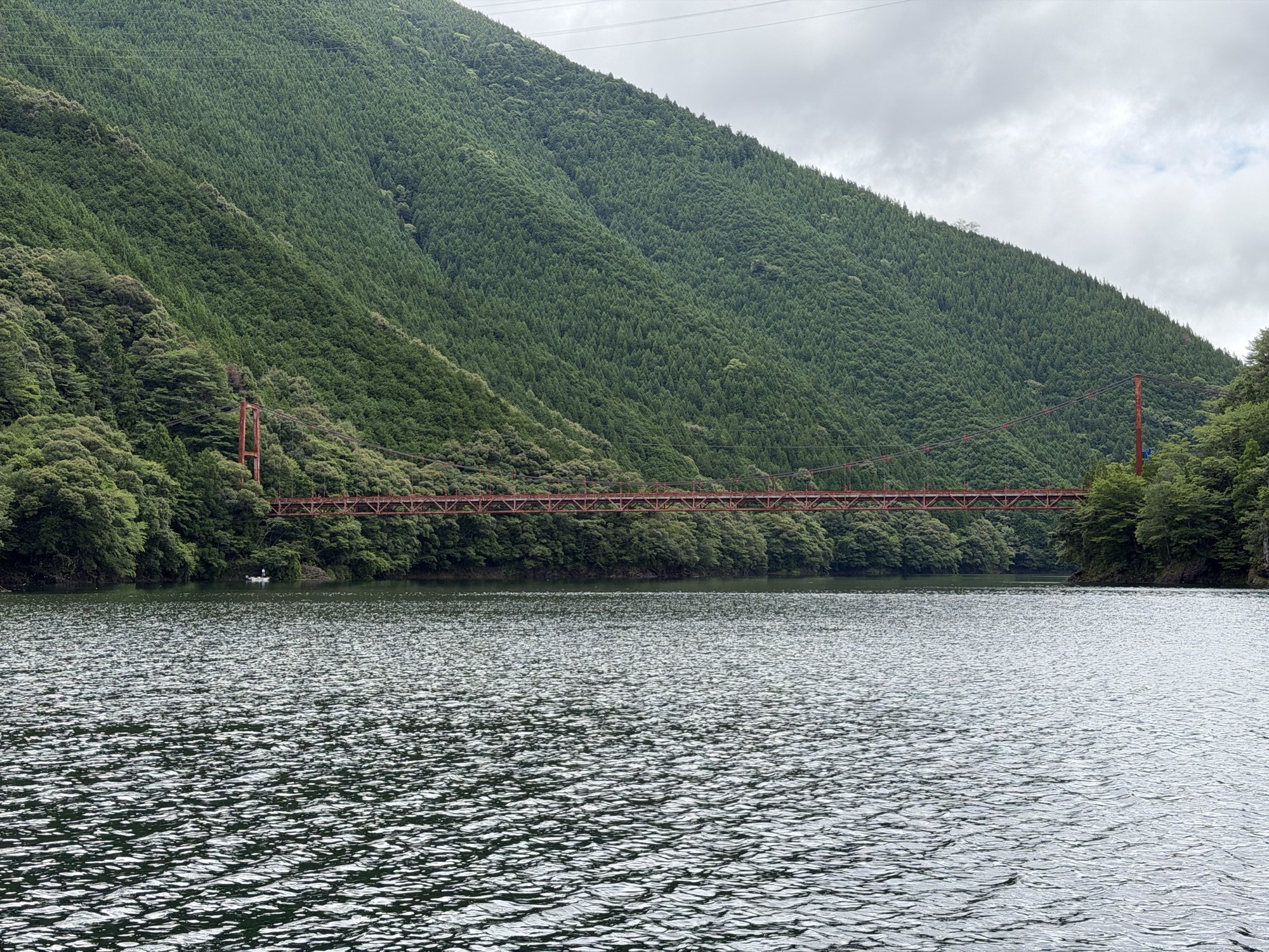 Steep mountain terrain surrounding Ikehara Dam reservoir