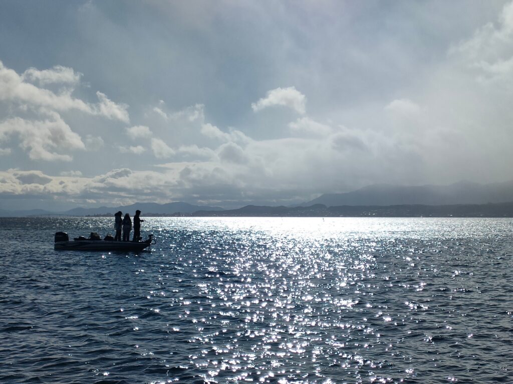 A bass boat on Lake Biwa's open central water, the deep body water area where current is felt most