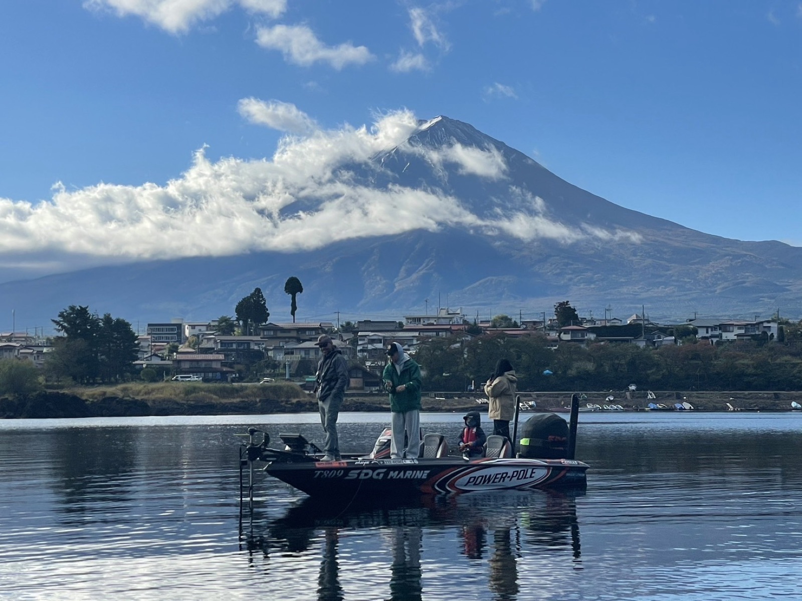 Anglers bass fishing on Lake Kawaguchi with Mt. Fuji in the background