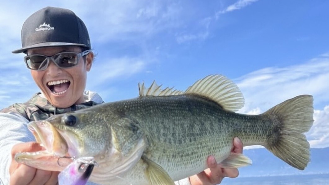 Lake Biwa fishing guide Yusuke Tanaka holding a big largemouth bass