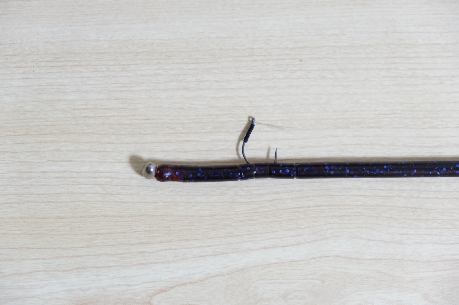 Finesse spinning rod and reel on a Lake Biwa guide boat